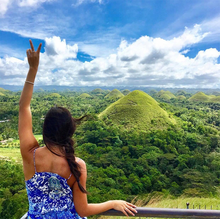 girl looking over chocolate hills