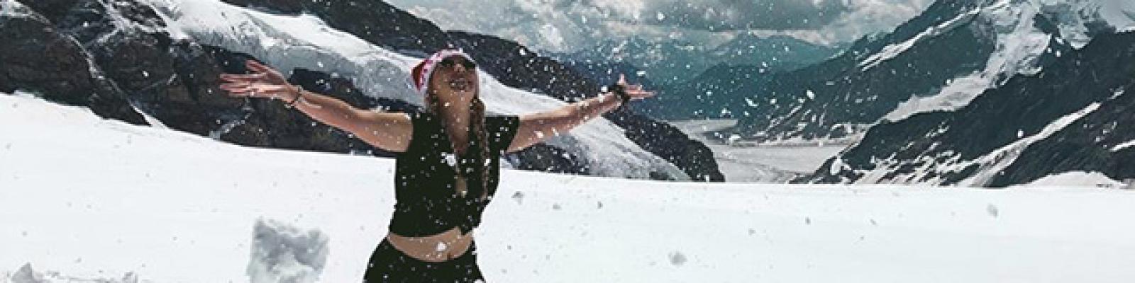 Girl on snowy mountain