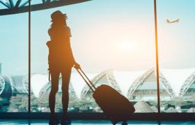 Woman looking out airport window
